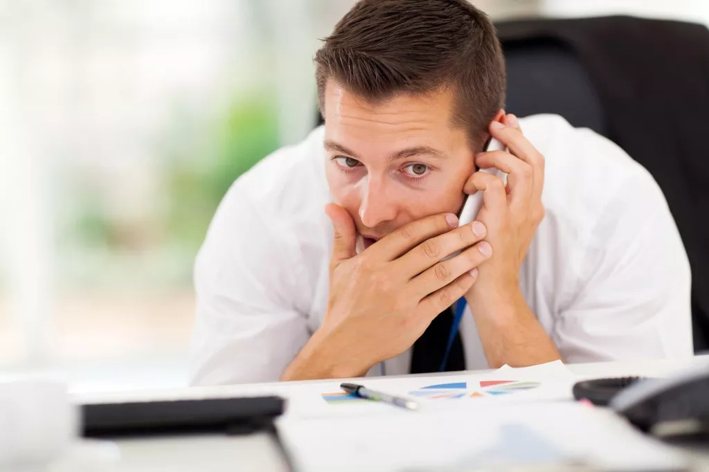 businessman taking a private call